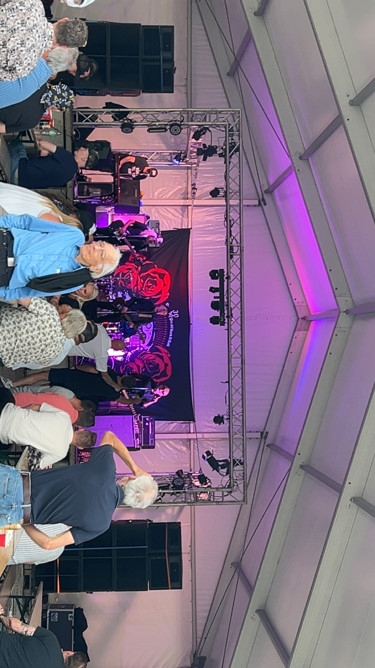 people standing on stage with lights
